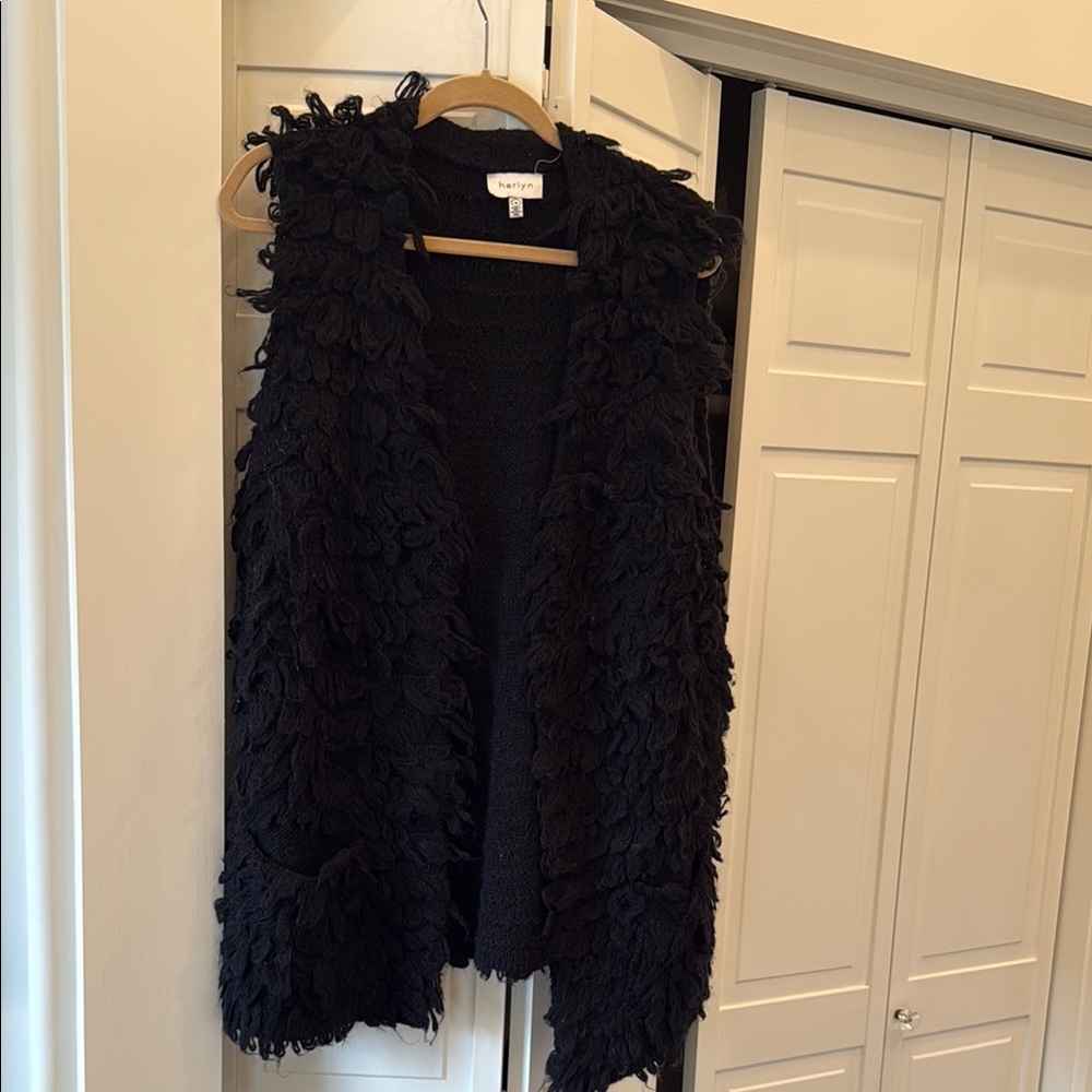 Sleek Black Vest With Versatile Design